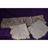 Three vintage and antique tablecloths, including 1930s embroidered example.