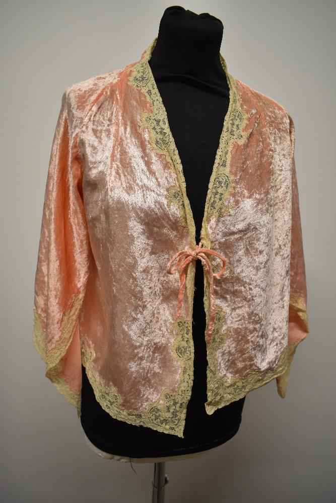 A decadent 1930s Art Deco bed jacket of pale pink velvet, having extensive lace edging, pointed