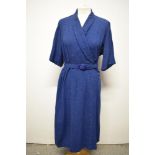A late 1940s/50s day dress of medium weight fabric in blue with grey fleck, with belt, larger size.