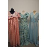 Three vintage maxi dresses, including 1970s floral dress with ruffled collar.