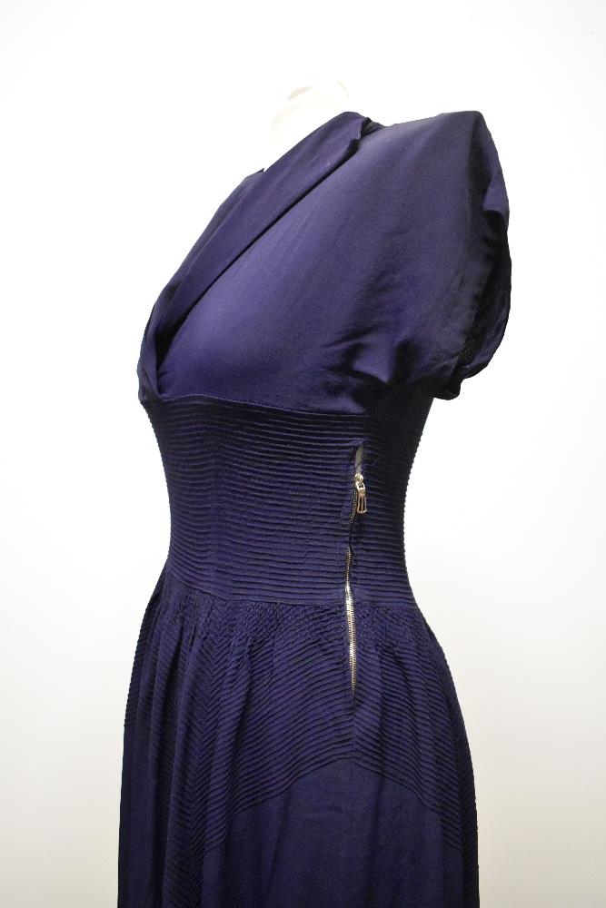 A striking 1940s navy blue floppy crepe day dress, having pointed cross over collar and tiny ribs of - Image 10 of 12