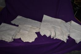 Five antique white work table cloths, all having intricate embroidery, crochet and other