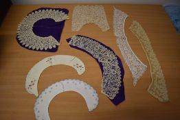 A collection of antique and vintage collars and a modesty panel, including pin wheel lace and