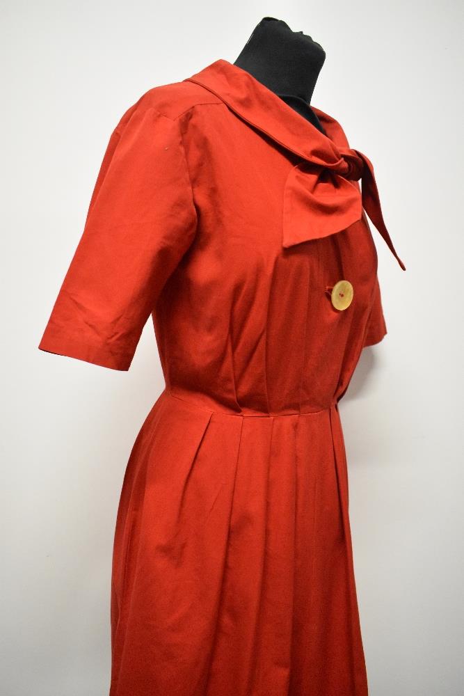 A 1950s medium weight cotton cherry red day dress, having large statement buttons, ties to neck, - Image 3 of 7