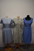 Three vintage 1950s and 1960s dresses, including abstract floral dress, medium sizes.