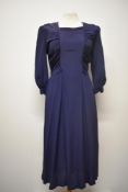 A late 30s/ early 1940s navy blue day dress having rushed detail to tapered bodice, full skirt, side