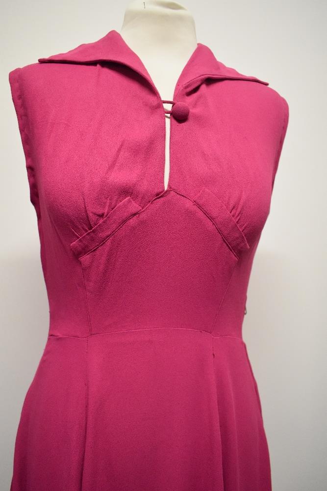 A 1940s cerise crepe dress, having button to bodice, side metal zip and fairly full panelled skirt. - Image 2 of 7