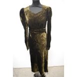 A 1930s dark olive green velvet bias cut evening gown, having long sleeves, sweetheart neckline