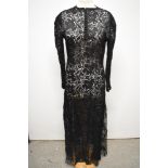 A 1930s bias cut lace evening dress, having button down front, round collar and long sleeves with