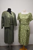 A 1950s sage green lace dress with matching jacket having Heiress label, original belt and back
