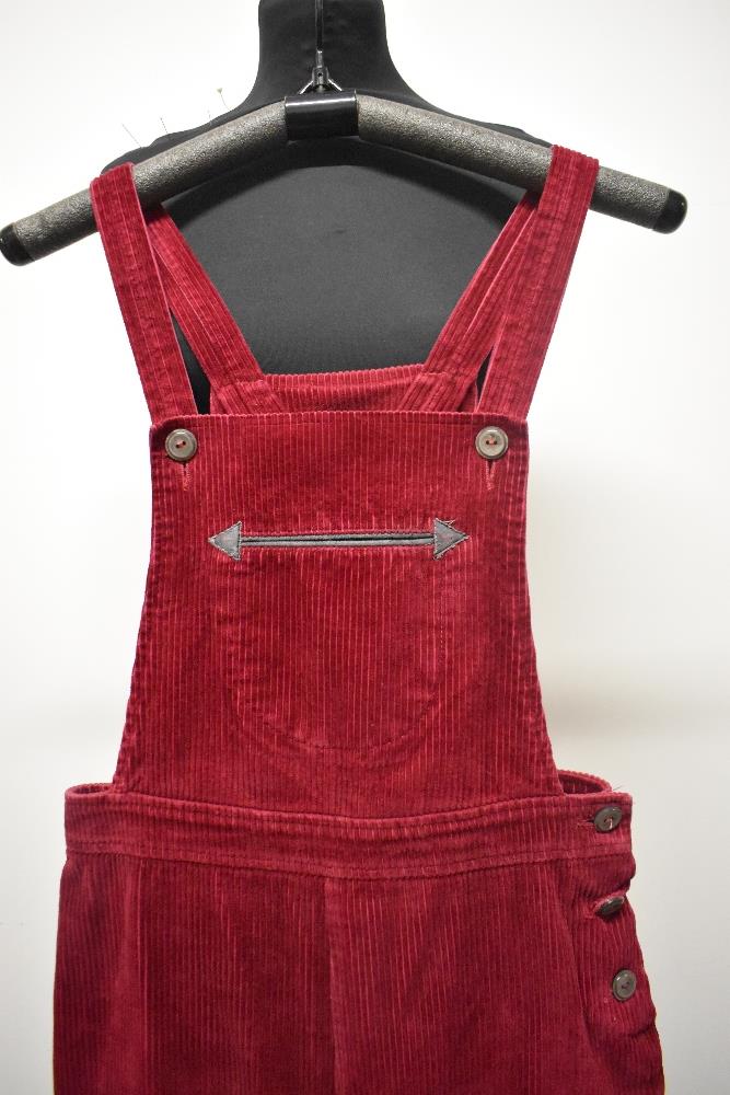 A pair of Circa mid century vibrant cherry red corduroy dungarees, having side button fastening, - Image 6 of 7