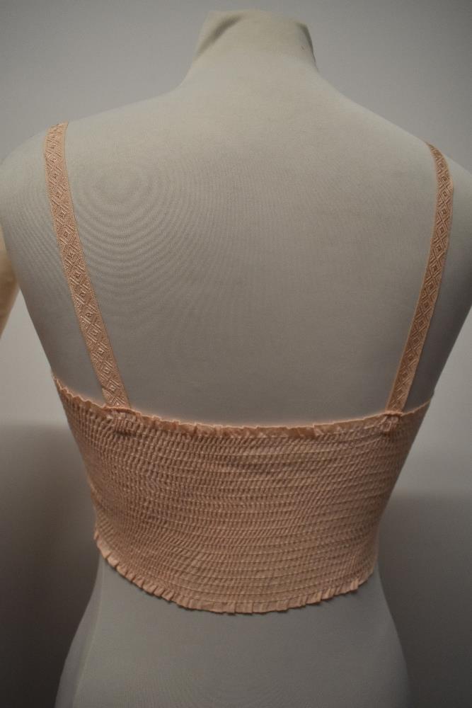 A 1940s strapless pink satin finish bra and a 1920s bralette with shirred back. - Image 4 of 10