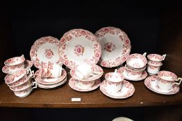 A Victorian porcelain part tea service on white ground and decorated with repeating floral motifs