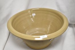 A 19th Century salt glazed dairy bowl, measuring 18cm tall with a diameter of 40cm