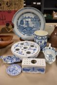 Three pieces of 18th/19th century blue and white ware, including baby feeder with scene of village