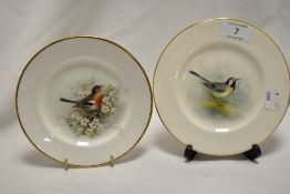 A pair of Royal Worcester porcelain cabinet plates, hand painted with birds, diameter 15cm