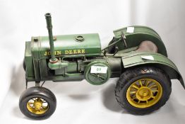 A collectable pressed metal model of a John Deere 1931 GP tractor, measuring 35cm long