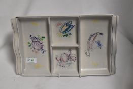 A Poole Pottery serving dish, having seafood designs to compartments.