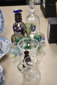 A mixed lot of vintage glass, including paperweights, fine green glass fluted bud vase, decanters