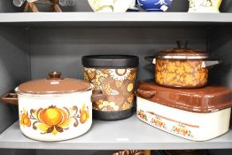 Three mid-20th Century enamelled and lidded cooking vessels and a plastic bucket of similar design