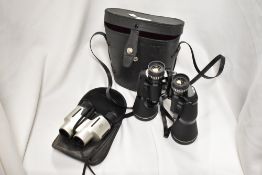 Two sets of binoculars, one pair Prinzlux and the other unbranded.