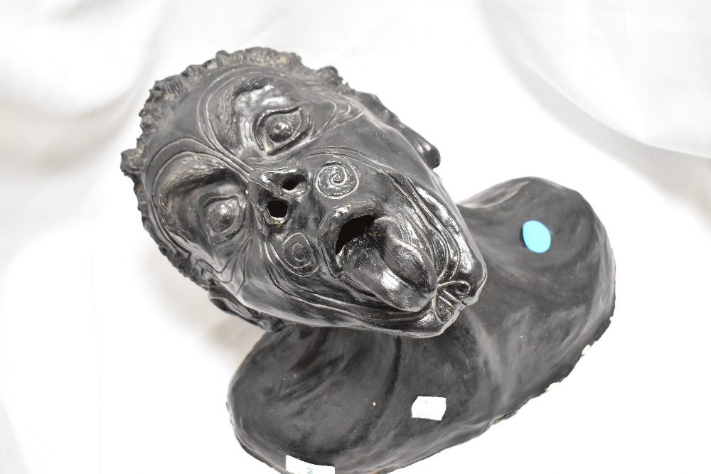 A 20th Century moulded and painted plaster bust in the form of a Maori male preforming Pukana , 24cm