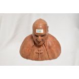 A well modelled terracotta/earthernware bust of a Catholic clergyman, with patinated finish.