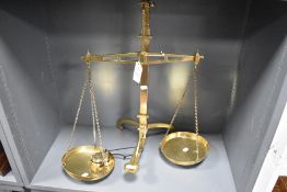 A set of early 20th Century brass Avery balance scales with weights, 62cm tall