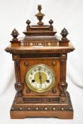 An early 20th Century German Wurttemberg walnut cased mantel clock, having an enamelled Arabic dial,