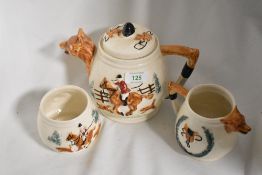 A trio of moulded fox hunting themed ceramics, including teapot sugar and milk jug, PPC England