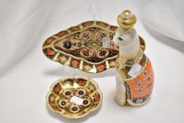 A Royal Crown Derby Royal Cats paperweight, 'Siamese', without stopper, and two Royal Crown Derby