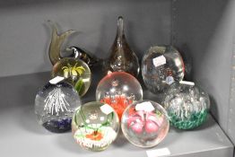 Nine Art Glass paperweights and dumps of different designs