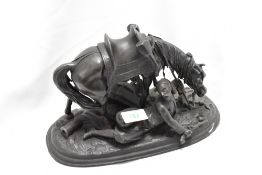A cast-spelter study of a fallen Islamic or Persian soldier and his steed, unmarked