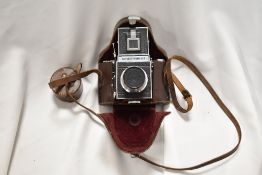 A vintage Reflex Korelle camera in leather case.