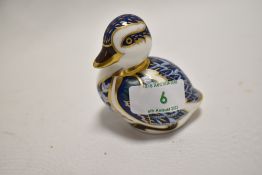 A Royal Crown Derby duck paperweight with silver coloured stopper, measuring 7cm tall