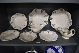 A collection of 19th century Waechtersbach reticulated cream ware plates and a similar jug, having