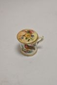 A miniature Royal Worcester hand painted cup, decorated with a robin, and a Royal Worcester blush