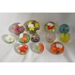 A collection of vintage floral paperweights and one Milliefiori.