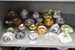 An assorted collection of art glass paperweights, of different forms, to include a Dynasty Gallery