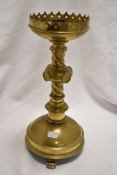 A group of four Gothic ecclesiastical brass candlesticks, measuring 37cm tall