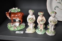 Three continental porcelain figural ornaments of flower gatherers, and a Derby porcelain cow and