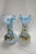 A pair of 19th Century Bohemian turquoise glass jugs, of aesthetic design with frilled rims, and