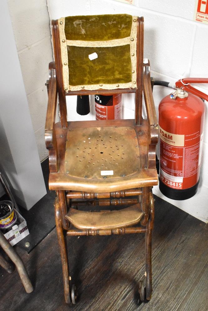A Victorian wooden high chair.