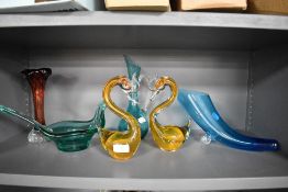 A selection of vintage art glass, including Cornucopia shaped blue vase, orange swan paperweights