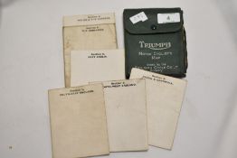 A scarce set of seven early 20th Century Triumph Motor Cyclist's Road Maps, displayed in a green