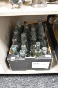 A box of vintage and antique glass advertising bottles, of Blackpool, Stockport, Ravensthorpe etc.