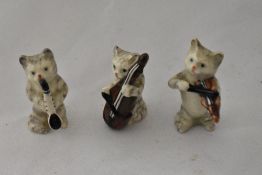 Three Vintage Beswick pottery cats, all playing musical instruments.