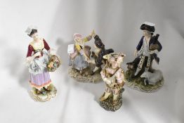 Four 20th century classically styled figurines, including one having crossed sword mark to