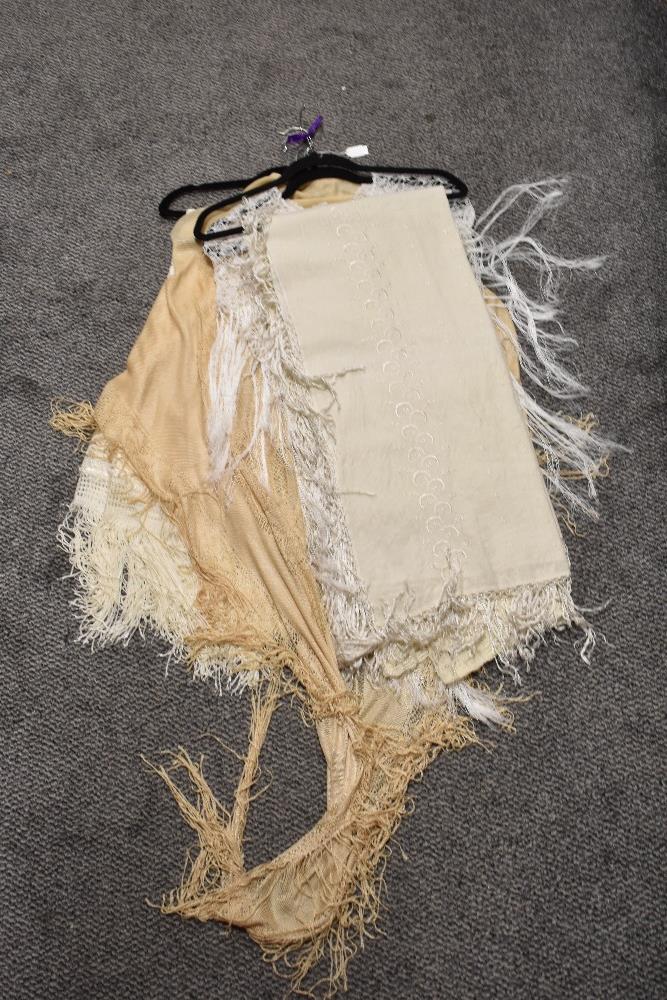 A collection of shawls, including two 1920s/30s rayon fringed shawls, crotcheted shawl and 1930s