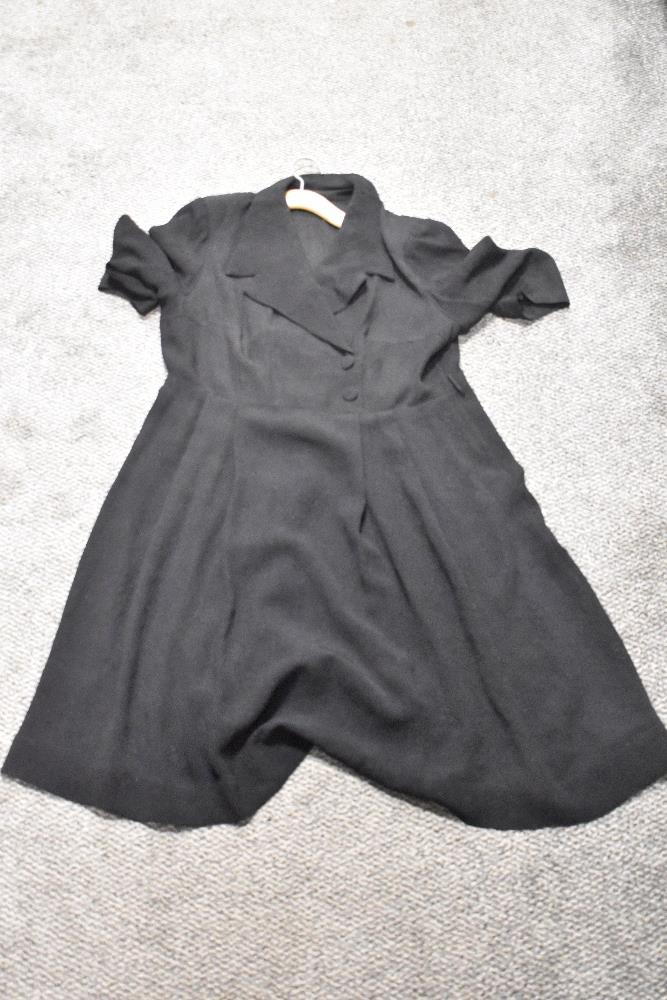 A 1940s textured day dress in black, faux cross over detail with buttons to front, 3/4 sleeves and